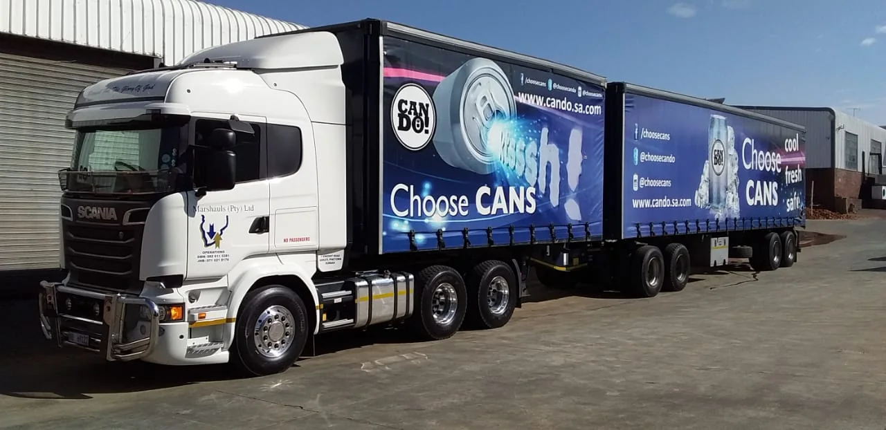 Scania interlink carrying CAN DO! branded client livery in the depot yard